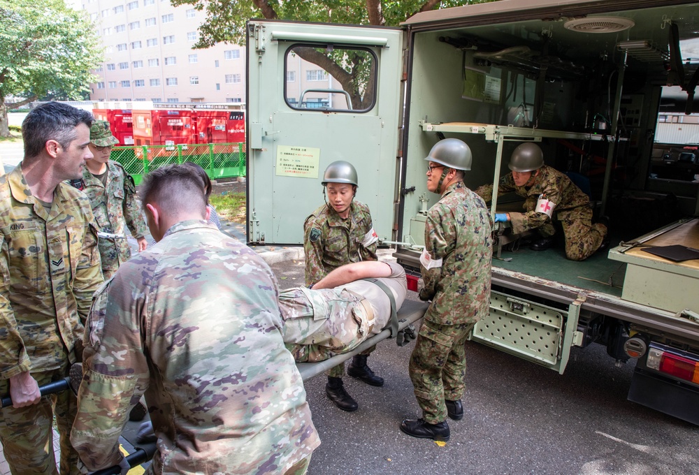 Medical personnel provide care during the Trilateral CASEVAC Training at Camp Asaka, Japan, Aug. 21, 2025.