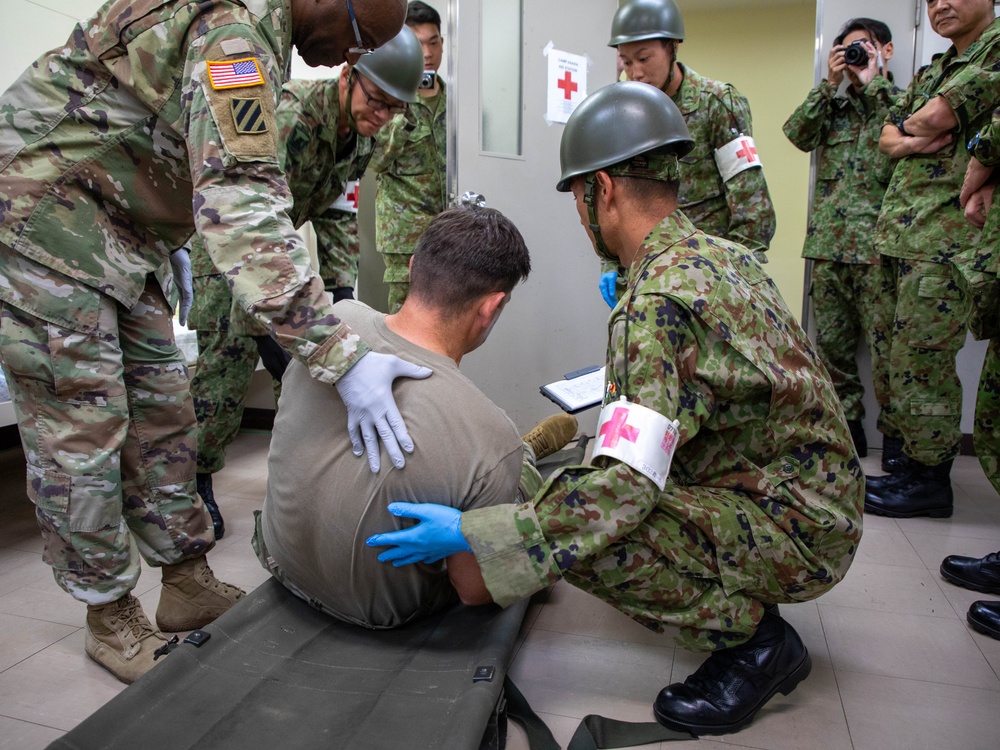 Medical personnel provide care during the Trilateral CASEVAC Training at Camp Asaka, Japan, Aug. 21, 2025.