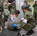 Medical personnel provide care during the Trilateral CASEVAC Training at Camp Asaka, Japan, Aug. 21, 2025.