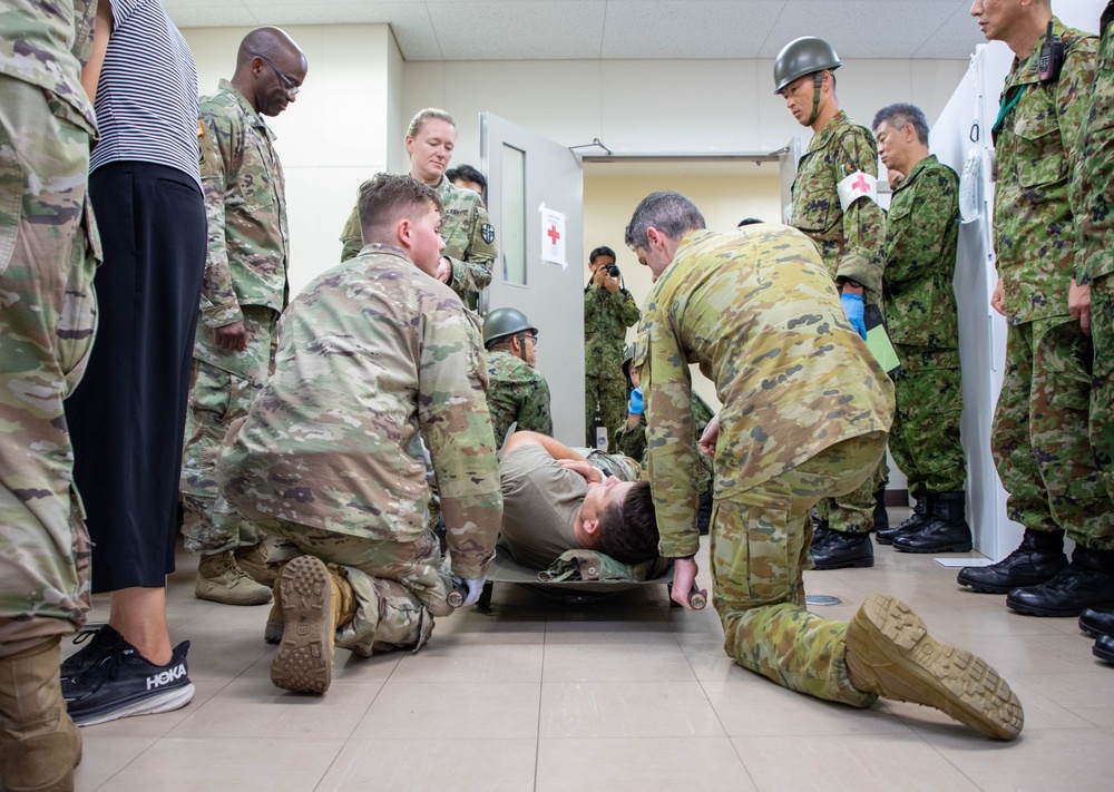 Medical personnel provide care during the Trilateral CASEVAC Training at Camp Asaka, Japan, Aug. 21, 2025.