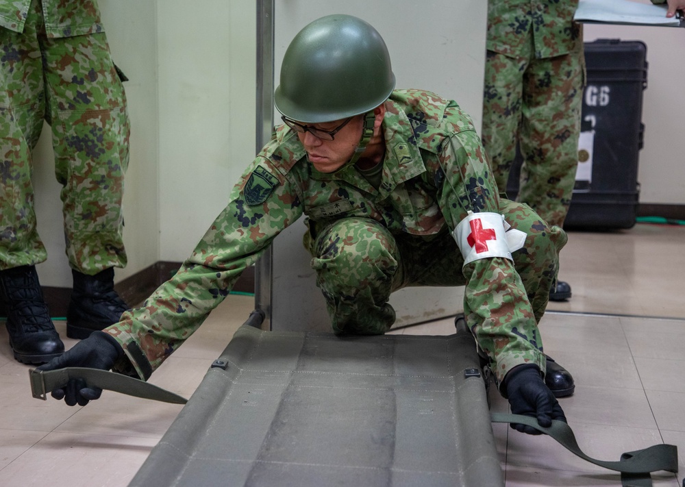 Medical personnel provide care during the Trilateral CASEVAC Training at Camp Asaka, Japan, Aug. 21, 2025.
