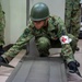 Medical personnel provide care during the Trilateral CASEVAC Training at Camp Asaka, Japan, Aug. 21, 2025.