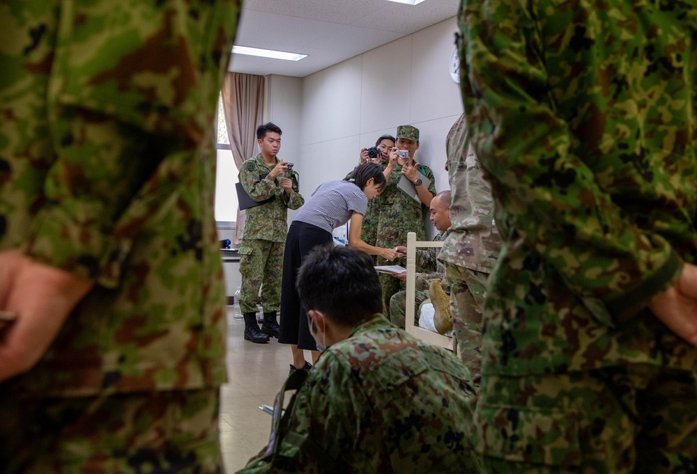 Medical personnel provide care during the Trilateral CASEVAC Training at Camp Asaka, Japan, Aug. 21, 2025.