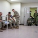 Medical personnel provide care during the Trilateral CASEVAC Training at Camp Asaka, Japan, Aug. 21, 2025.