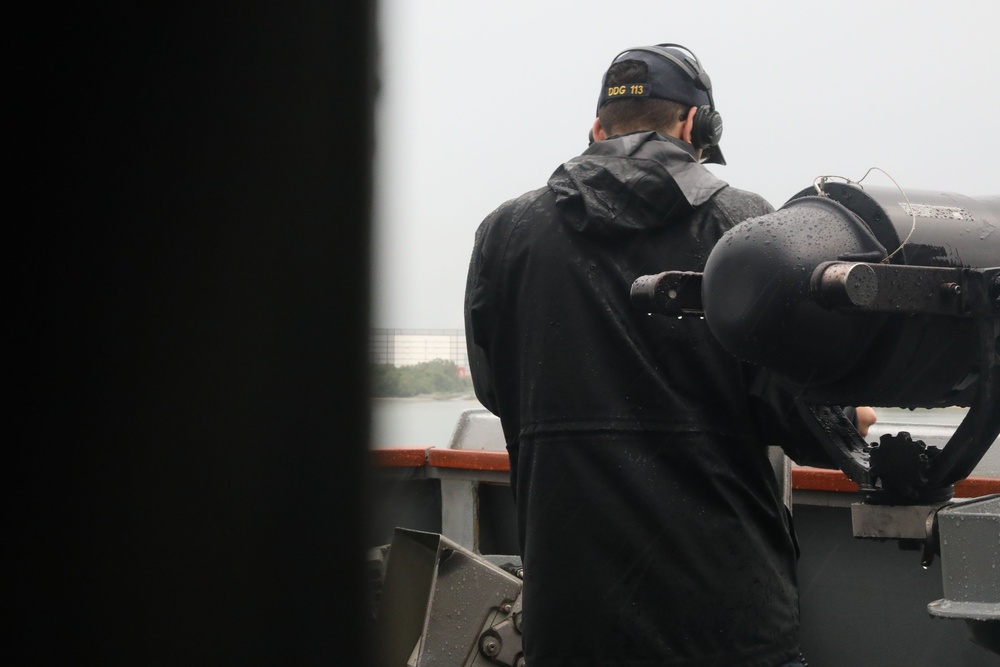 Sailors aboard the USS John Finn conduct a sea and anchor detail in Sembawang, Singapore