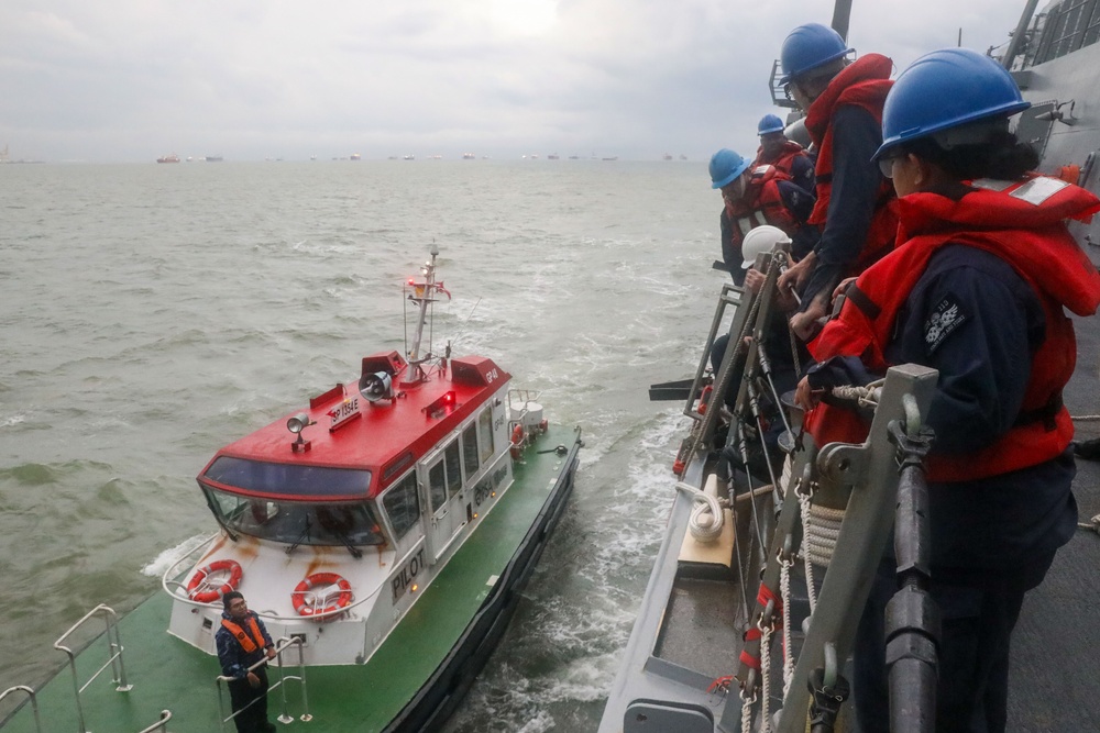 Sailors aboard the USS John Finn conduct a sea and anchor detail in Sembawang, Singapore