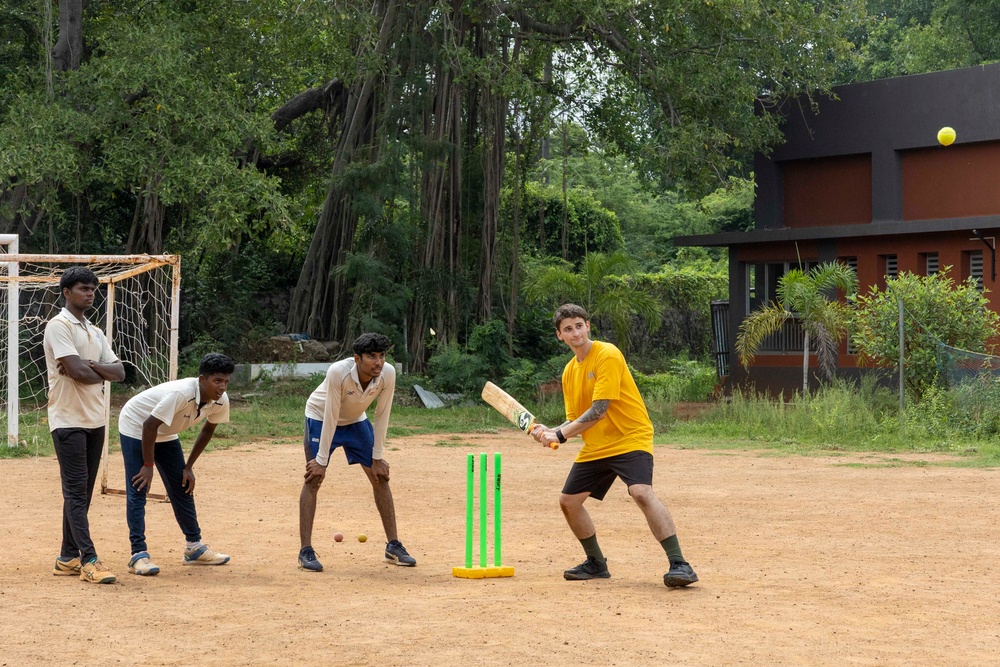 USS Frank Cable (AS 40) Sailors participate in sports with Guru Nanak College students