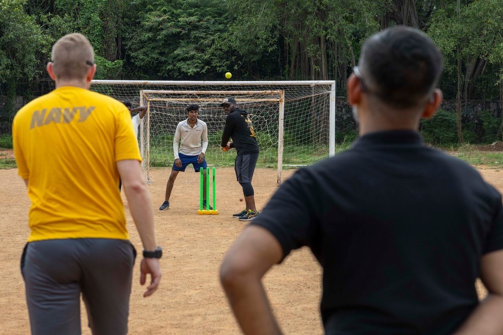 USS Frank Cable (AS 40) Sailors participate in sports with Guru Nanak College students