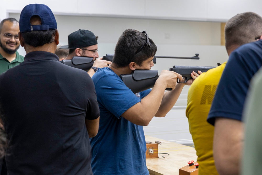 USS Frank Cable (AS 40) Sailors participate in sports with Guru Nanak College students