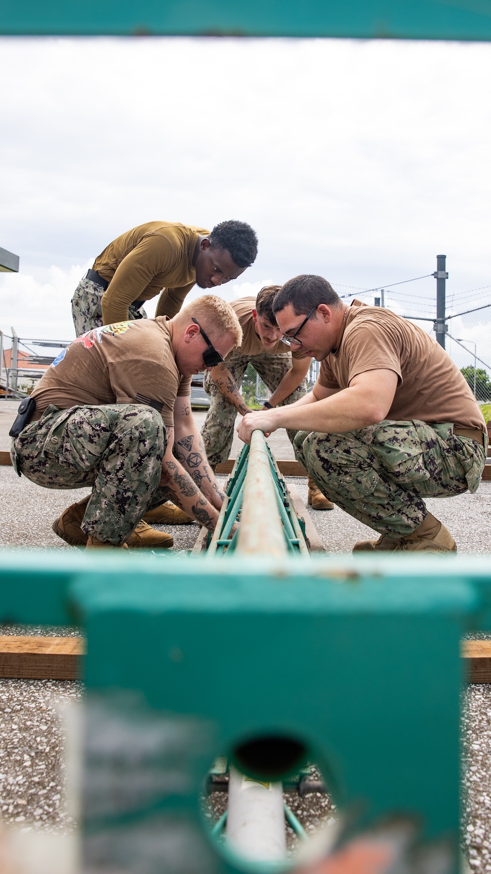 NMCB 4 Seabees Assemble Power Screed