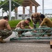 NMCB 4 Seabees Assemble Power Screed