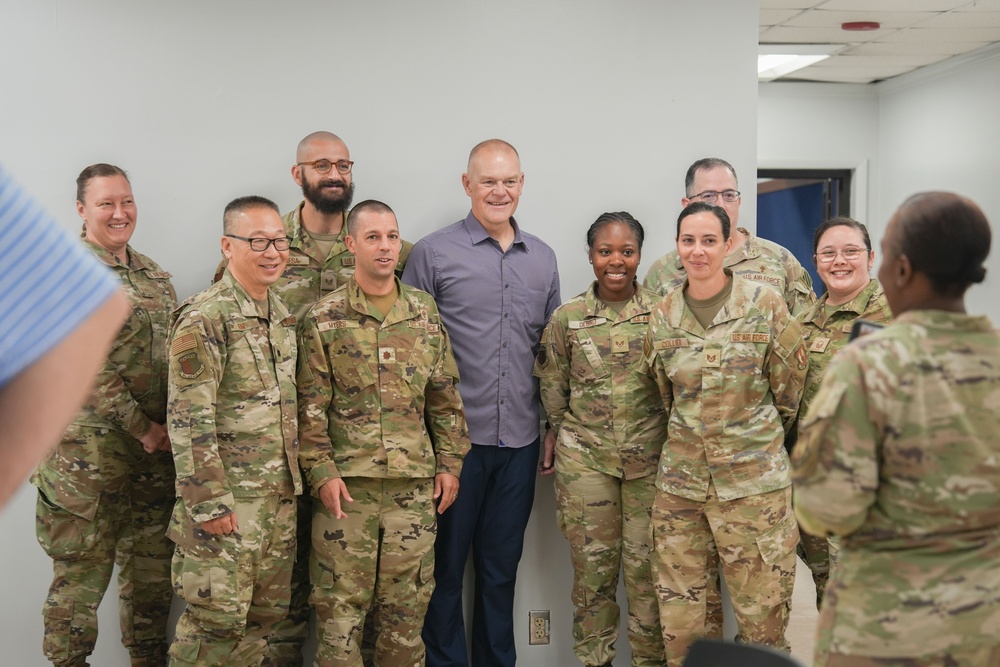 Retired CMSAF Roy coins Staff Sgt. Debro