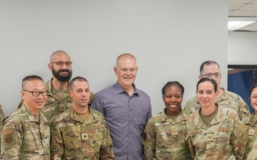 Retired CMSAF Roy coins Staff Sgt. Debro