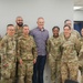 Retired CMSAF Roy coins Staff Sgt. Debro