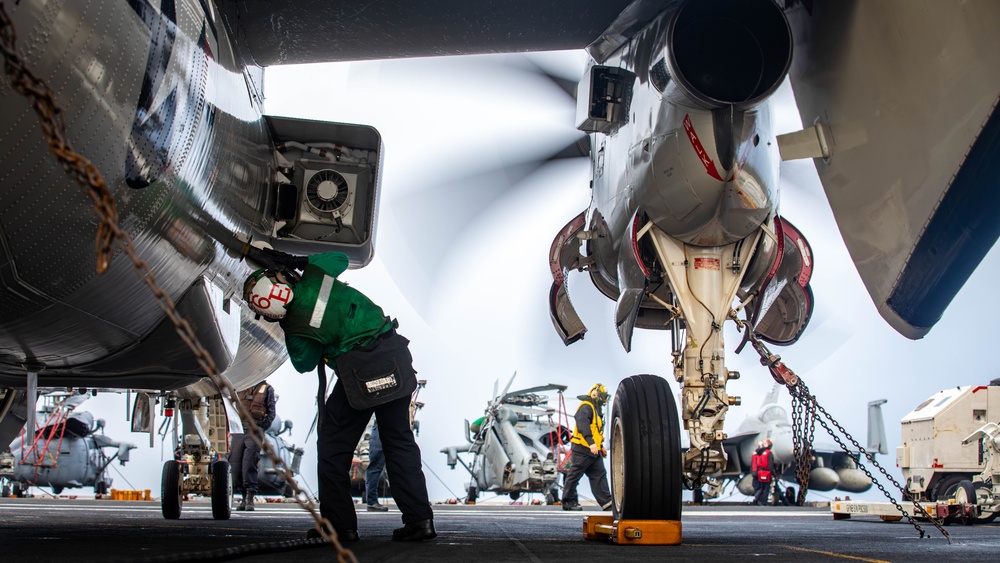 VAW-124 Sailor Conducts Post-Flight Checks