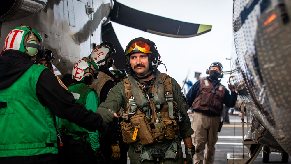 VAW-124 Sailor Greets Flight Deck Crew