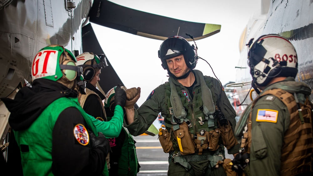 VAW-124 Sailor Greets Flight Deck Crew