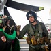 VAW-124 Sailor Greets Flight Deck Crew