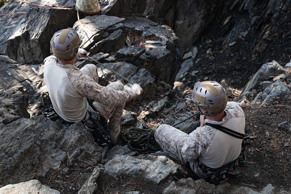 V35 and V11 Marines conduct lead climbing during Assault Climbers Course