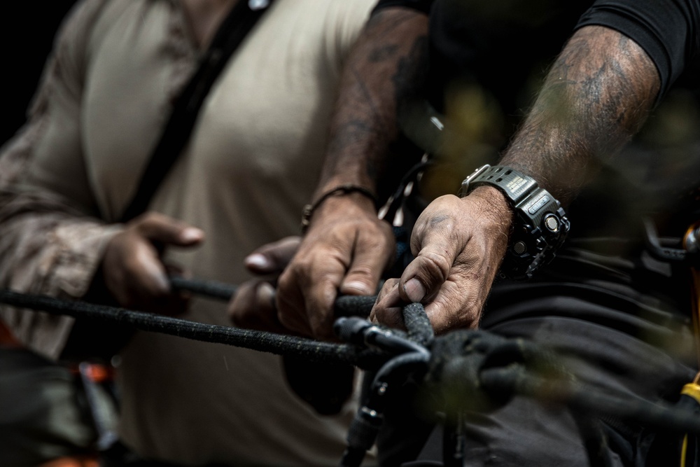V35 and V11 Marines conduct lead climbing during Assault Climbers Course