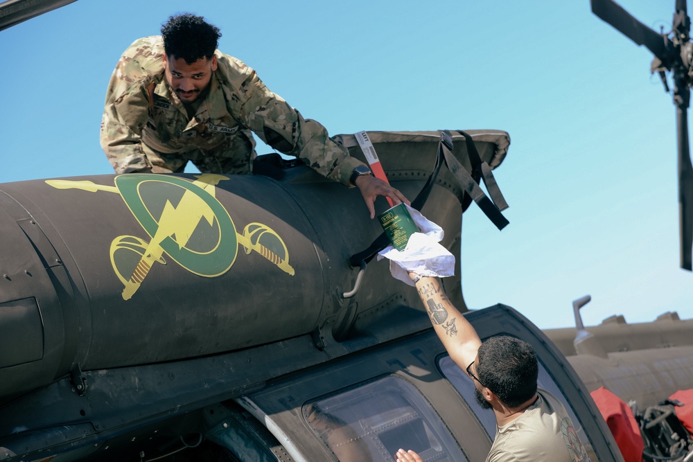U.S. Army Soldiers conduct maintenance on a UH-60 Blackhawk