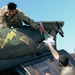 U.S. Army Soldiers conduct maintenance on a UH-60 Blackhawk