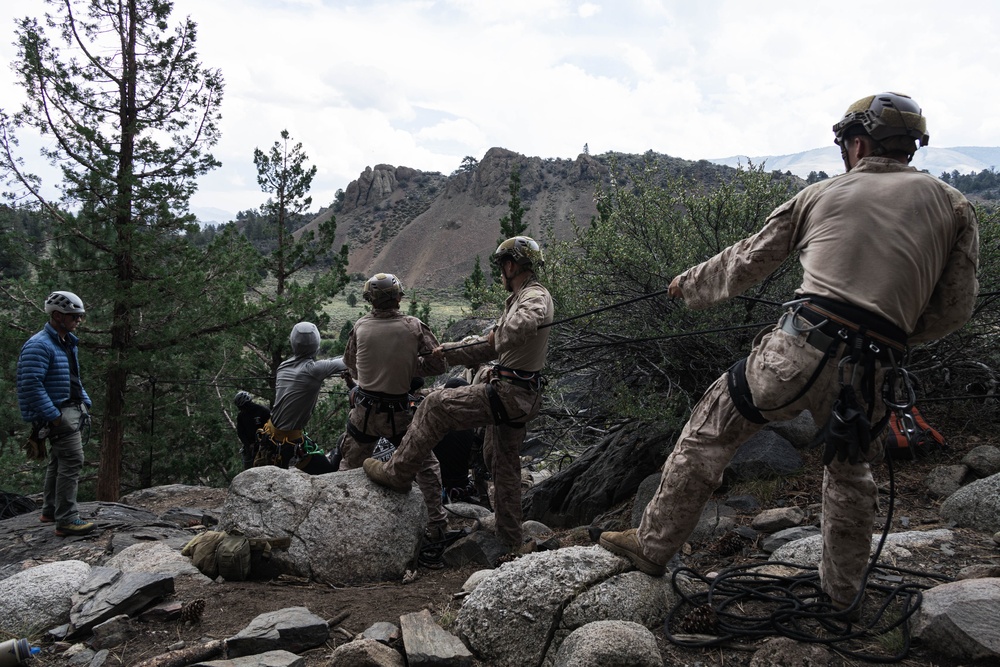 V35 and V11 Marines conduct lead climbing during Assault Climbers Course