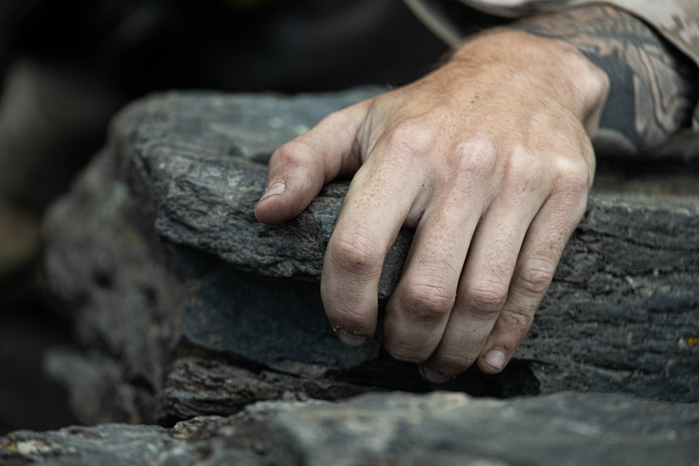 V35 and V11 Marines conduct lead climbing during Assault Climbers Course