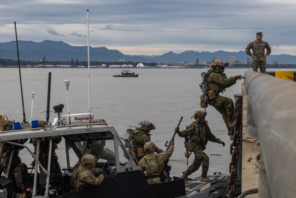 U.S. Marines with 3rd Bn., 4th Marines, U.S. Coast Guardsmen with PSU 113 conduct amphibious raid during ARCTIC EDGE 2025