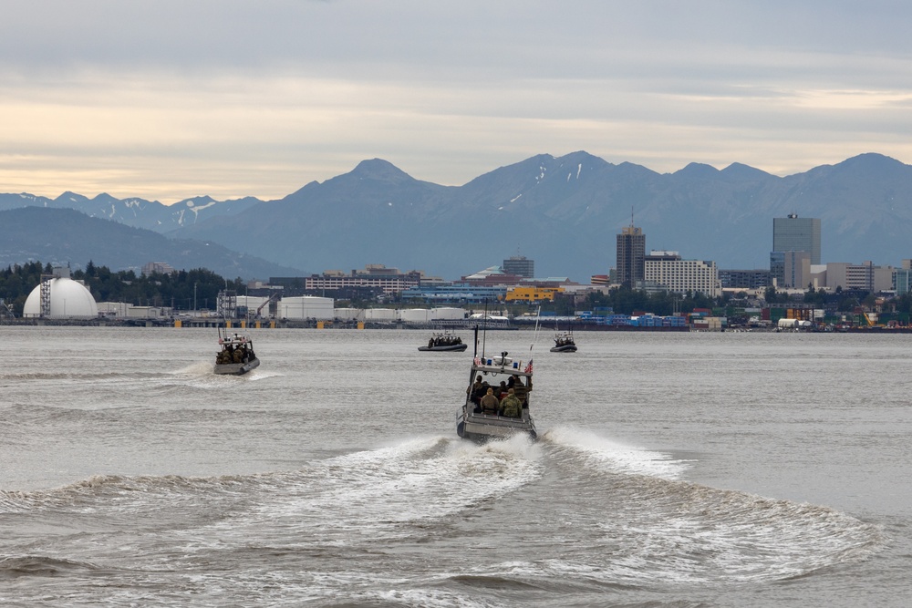 U.S. Marines with 3rd Bn., 4th Marines, U.S. Coastguardsmen with PSU 113 conduct amphibious raid during ARCTIC EDGE 2025