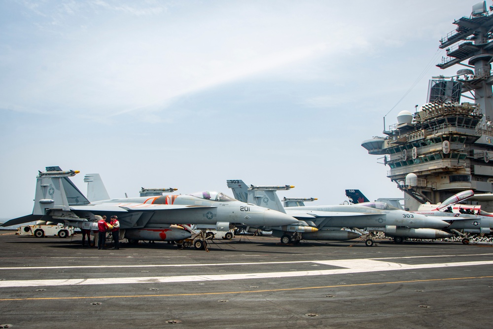 Nimitz Sailors Load Ordnance