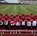 Team holding “We ♥ 73” signs