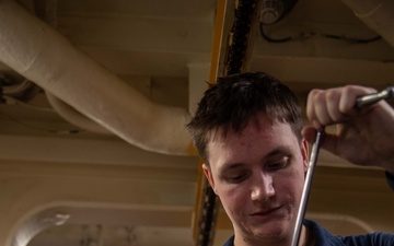 USS Gerald R. Ford (CVN 78) Sailor Conducts Maintenance