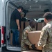 US Army Soldiers distribute food
