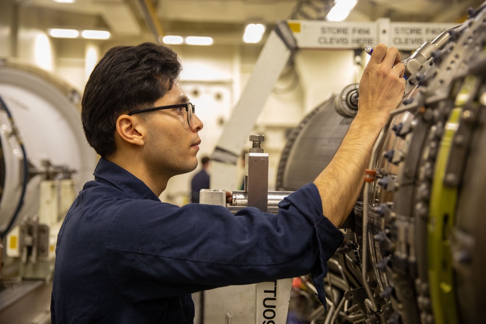 USS Gerald R. Ford (CVN 78) Sailor Conducts Maintenance