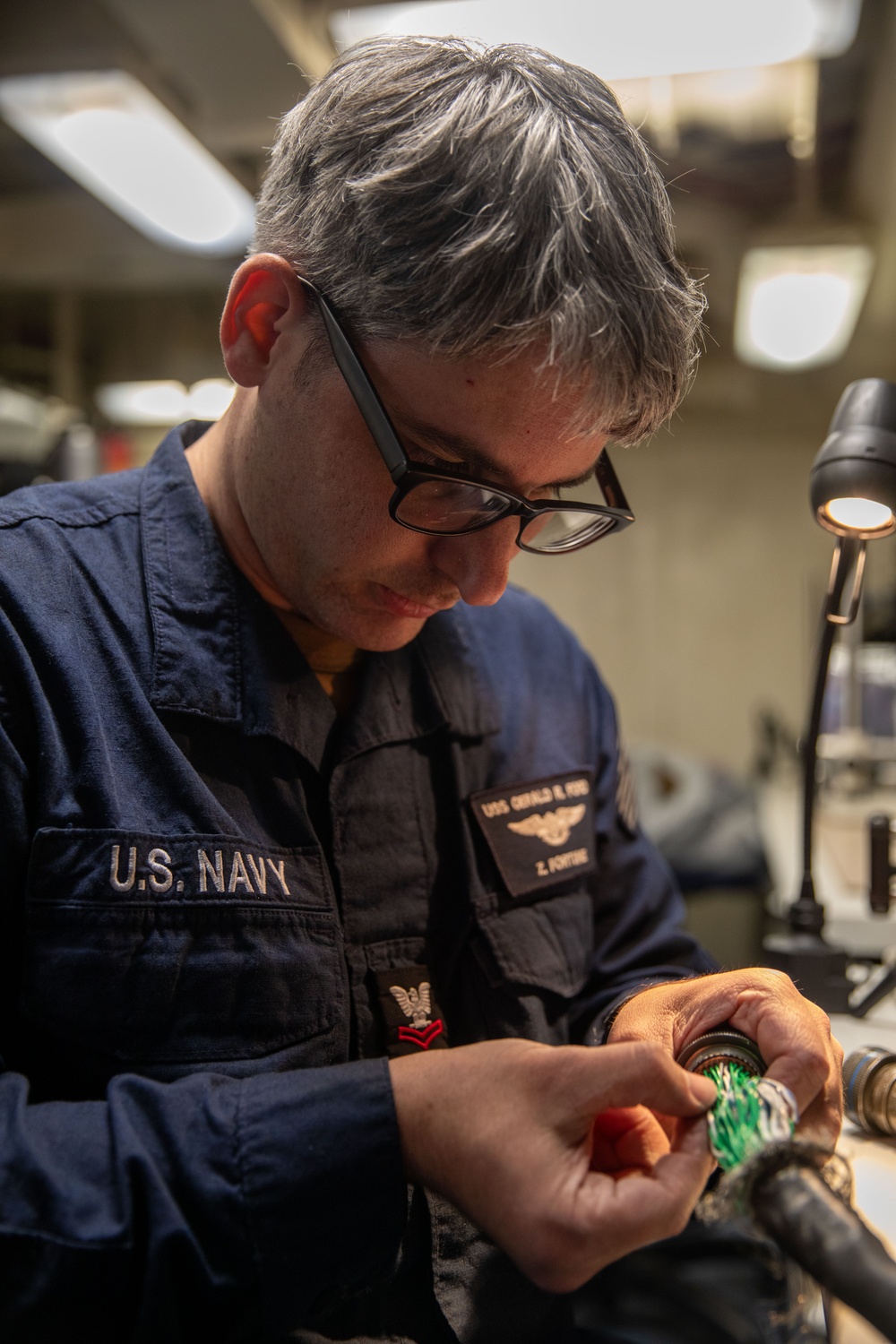 USS Gerald R. Ford (CVN 78) Sailor Repairs Equipment