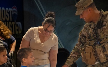US Army Soldier Hands Child US Flag Patch in Washington, D.C.