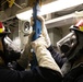 USS Mitscher (DDG 57) Sailors install shoring during GQ