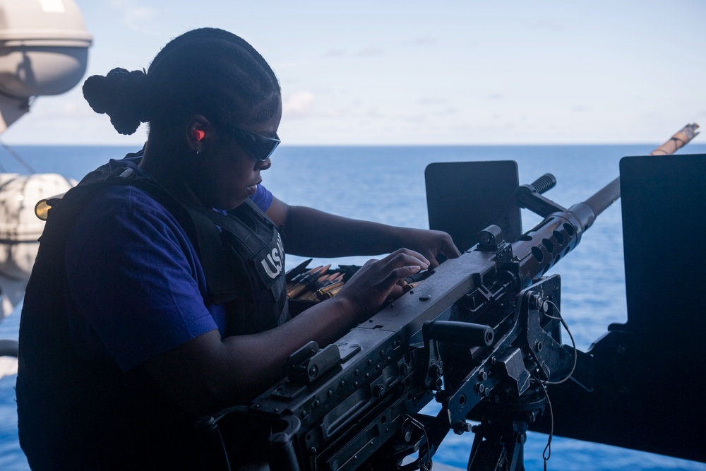 Sailors conduct a crew-served weapons live-fire exercise on the USS America (LHA 6)