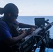Sailors conduct a crew-served weapons live-fire exercise on the USS America (LHA 6)