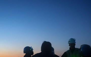 USS Bulkeley Sailors conduct a safety brief on the foc’sle prior to a night time sea-and-anchor transit