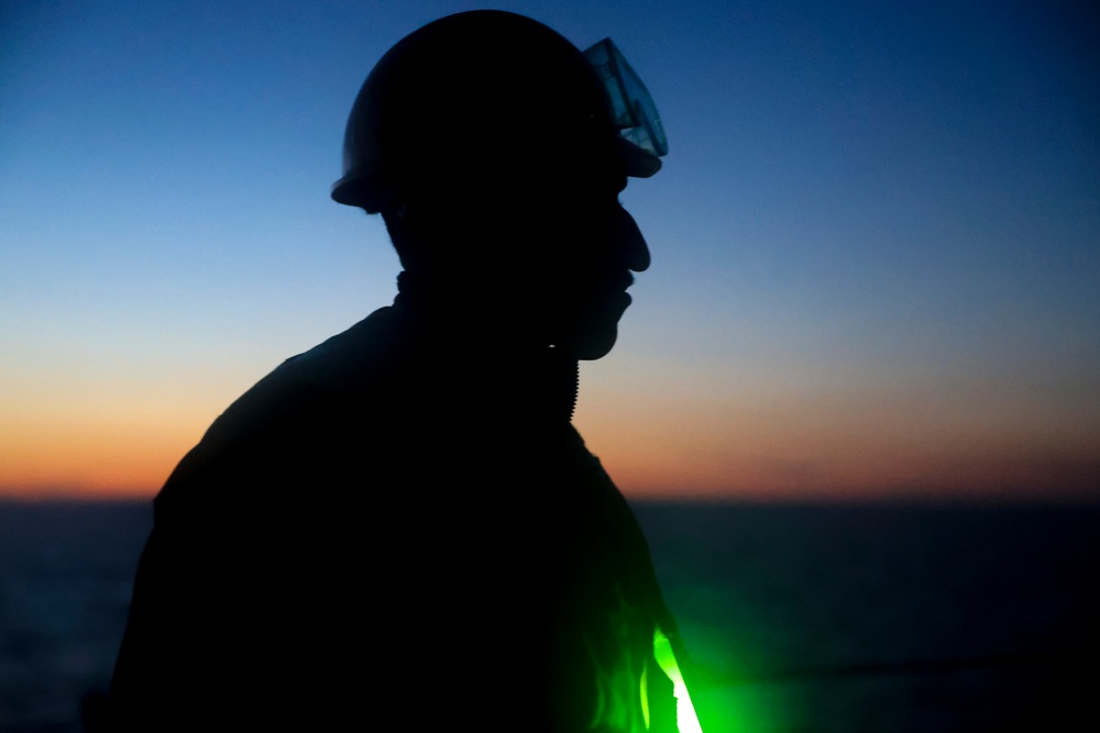 BM1 Youssef Belakbir stands watch on the foc’sle during a transit through the Straits of Dover