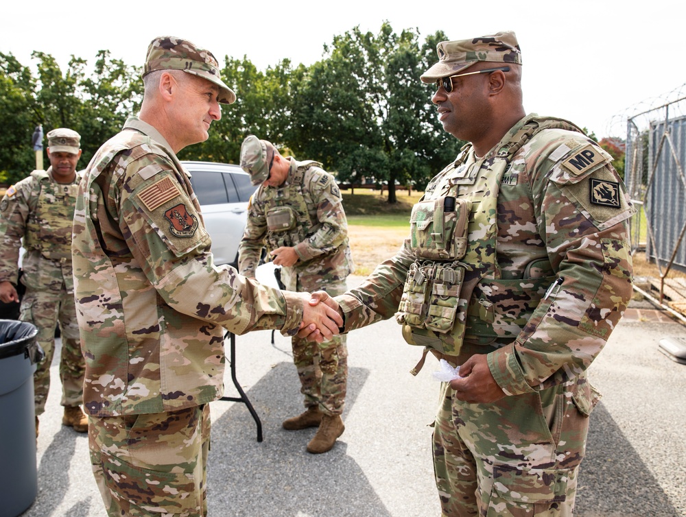 U.S. Air Force Gen. Steven Nordhaus, Chief of the National Guard Bureau, receives a Coin from U.S. Army Lt. Col. Steven Jackson