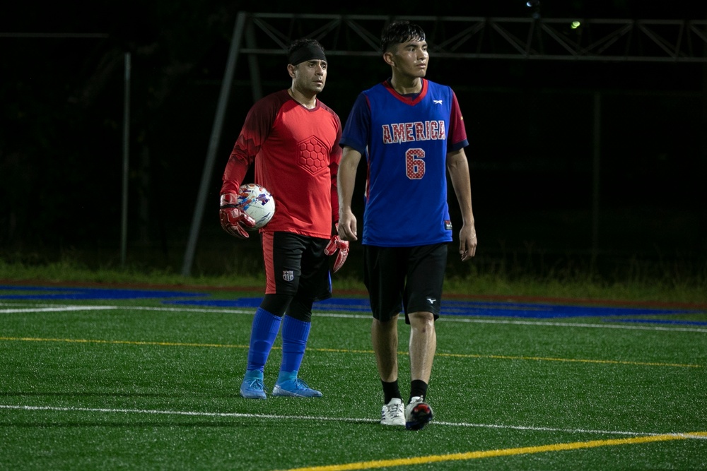 USS Tripoli and USS America Sailors Play Soccer