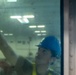Tripoli Sailor Cleans Windows of the Hanger Deck Control Room