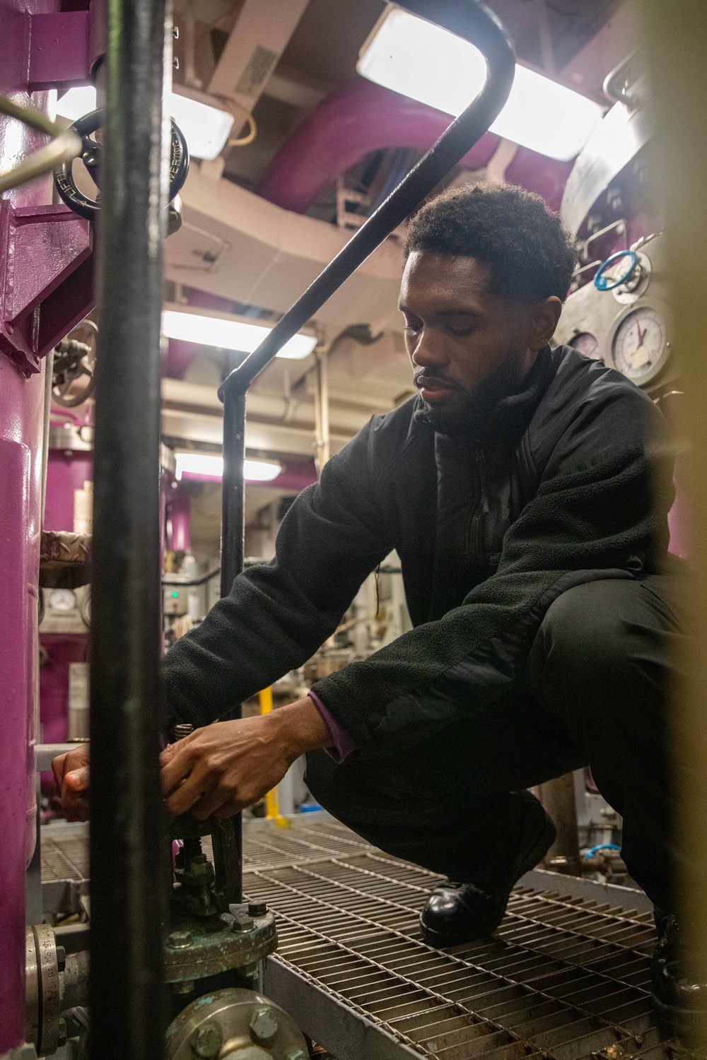 USS Gerald R. Ford (CVN 78) Sailor Operates Pumps in Engine Room