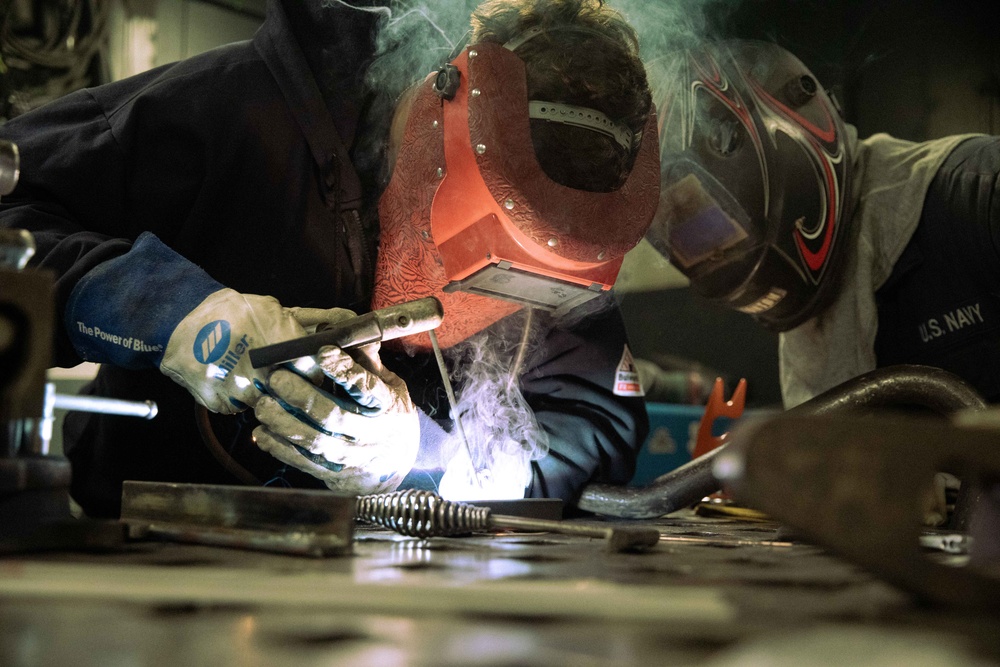 USS Gerald R. Ford (CVN 78) Sailor Conducts Maintenance