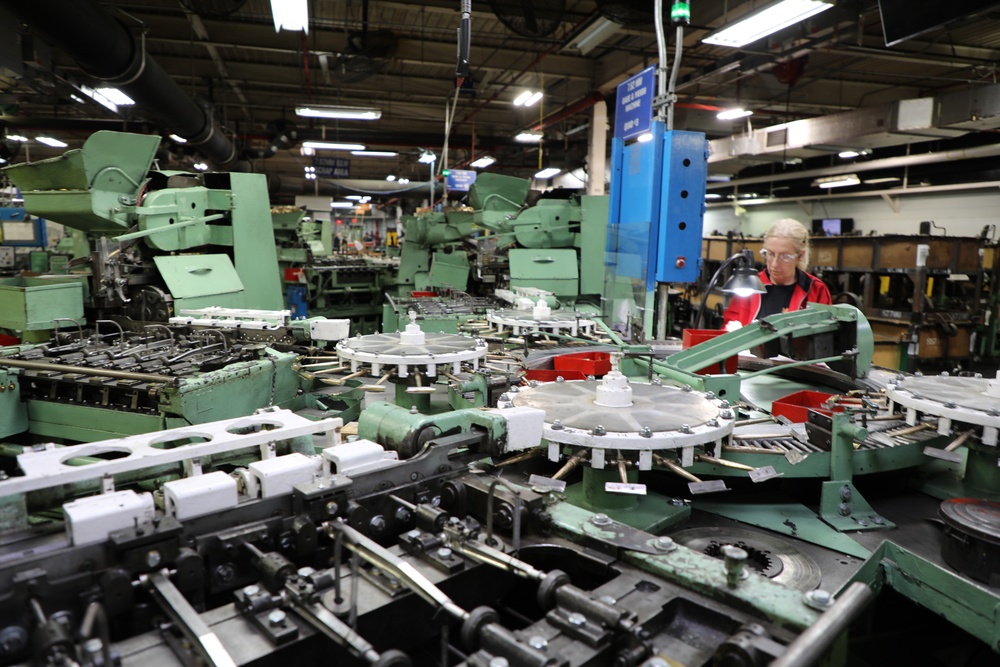 Lake City Army Ammunition Plant employee inspects ammunition prior to packaging.