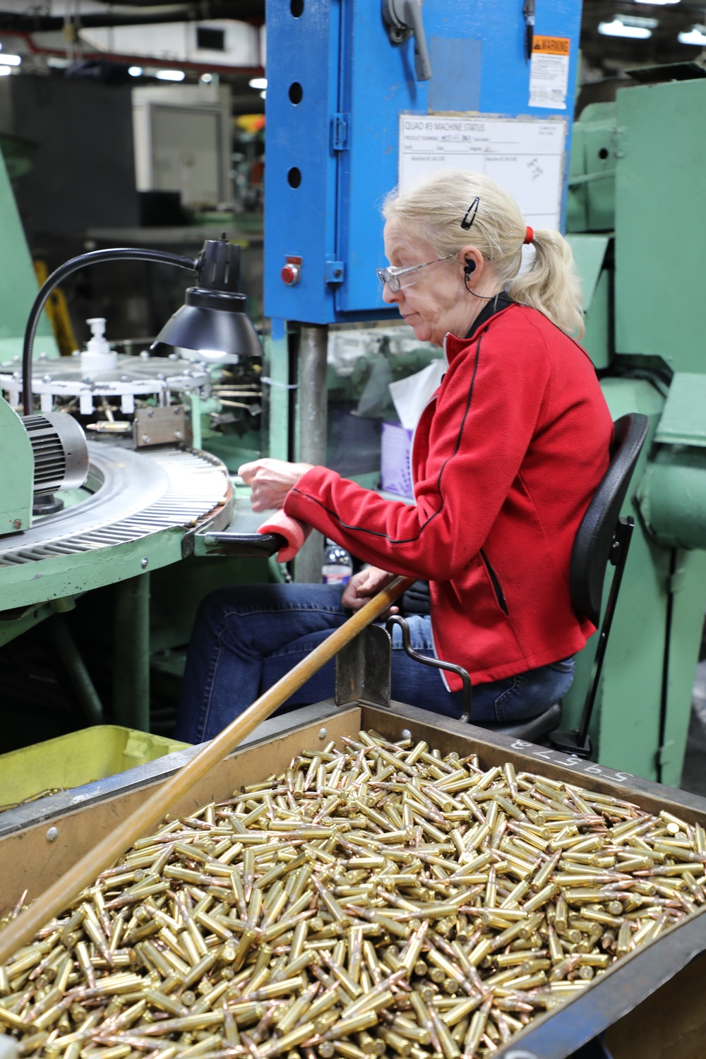 Lake City Army Ammunition Plant employee does a quality inspection on ammunition.