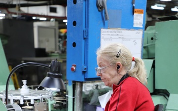 Lake City Army Ammunition Plant employee does a quality inspection on ammunition.